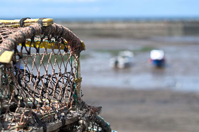 Close-up of fishing net on beach