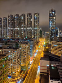 High angle view of illuminated street amidst buildings in hong kong at night