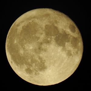 Low angle view of moon against sky at night