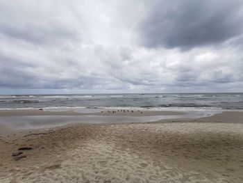 Scenic view of beach against sky