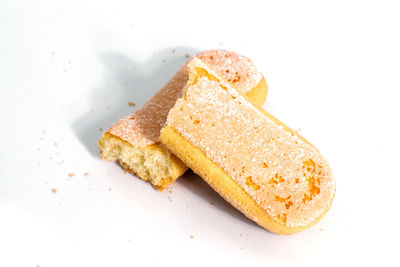 High angle view of bread in plate against white background