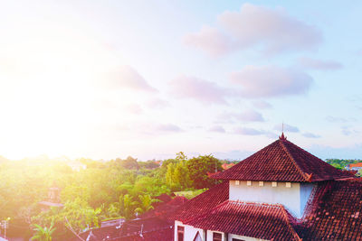 High angle view of house and buildings against sky