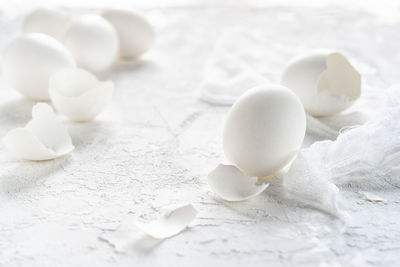 Close-up of broken egg shells on table