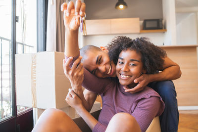 Portrait of smiling man with woman at home