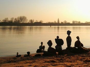 Scenic view of lake at sunset