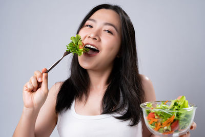 Portrait of woman eating food