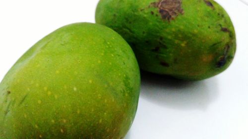 Close-up of green fruits on table