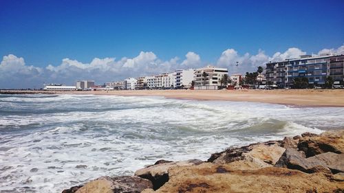 Scenic view of beach and sea against sky