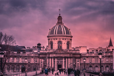 View of buildings in city at sunset