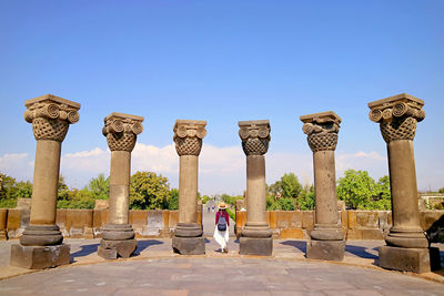 Female visitor at zvartnots cathedral, amazing unesco world heritage site in armenia