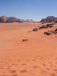 Scenic view of desert against clear sky