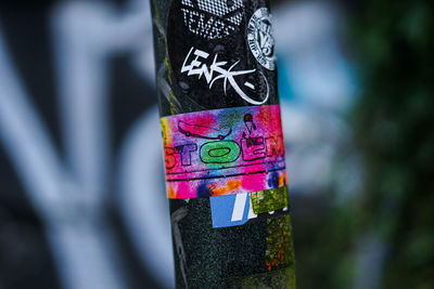 Close-up of graffiti on tree trunk
