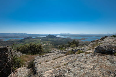 Scenic view of landscape against clear blue sky