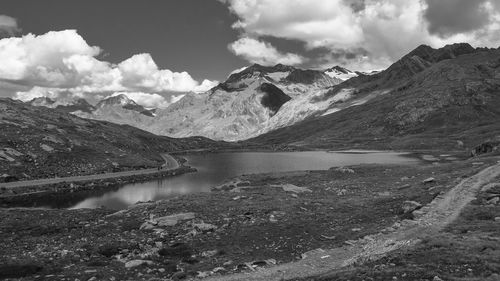 Scenic view of lake and snowcapped mountains against sky