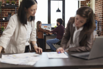 Friends working at office