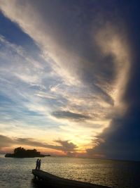 Scenic view of calm lake at sunset