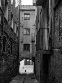 Alley amidst buildings in city