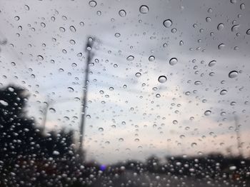 Close-up of raindrops on glass window