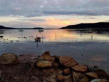 Scenic view of sea against sky at sunset