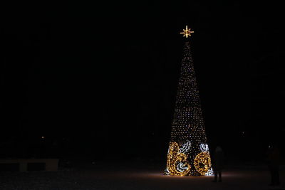 Illuminated christmas tree at night
