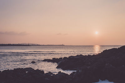 Scenic view of sea against sky during sunset