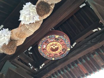 Low angle view of decoration hanging on ceiling in building