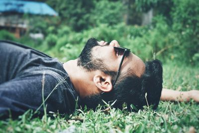 A boy laying on the grass