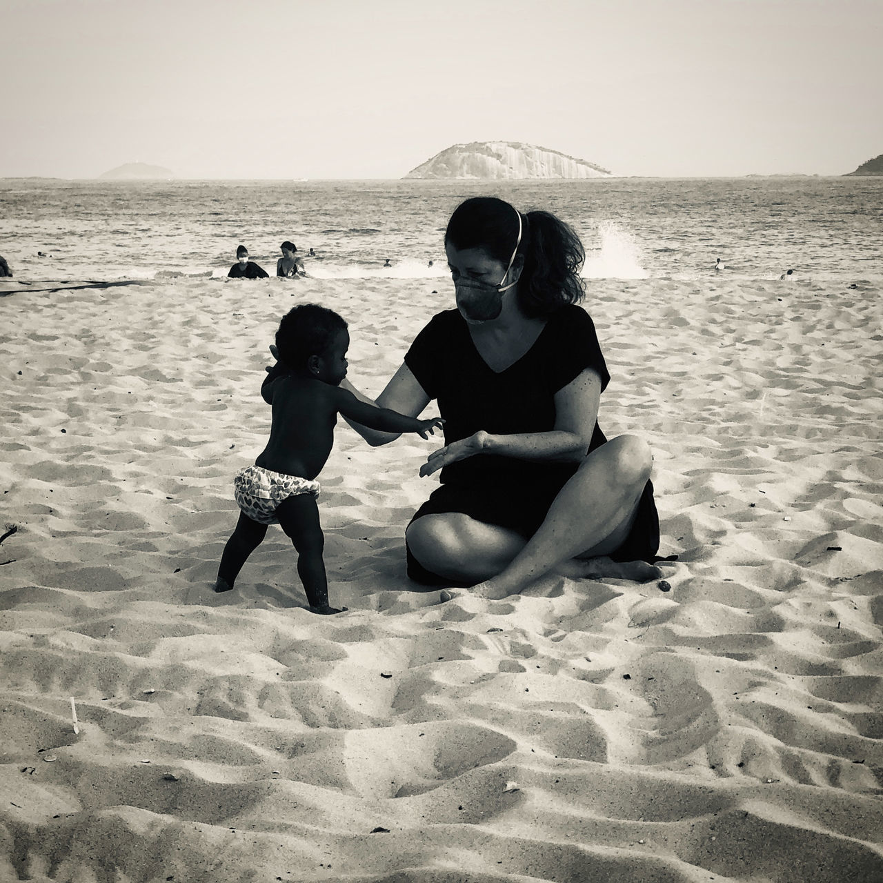 REAR VIEW OF WOMEN ON SHORE