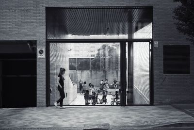 Woman standing in front of building