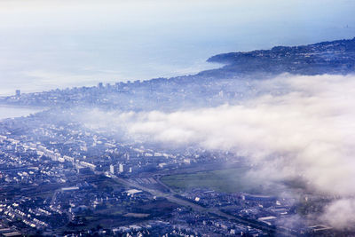 Aerial view of cityscape against sky