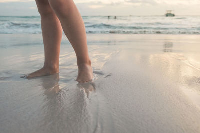 Low section of girl on beach