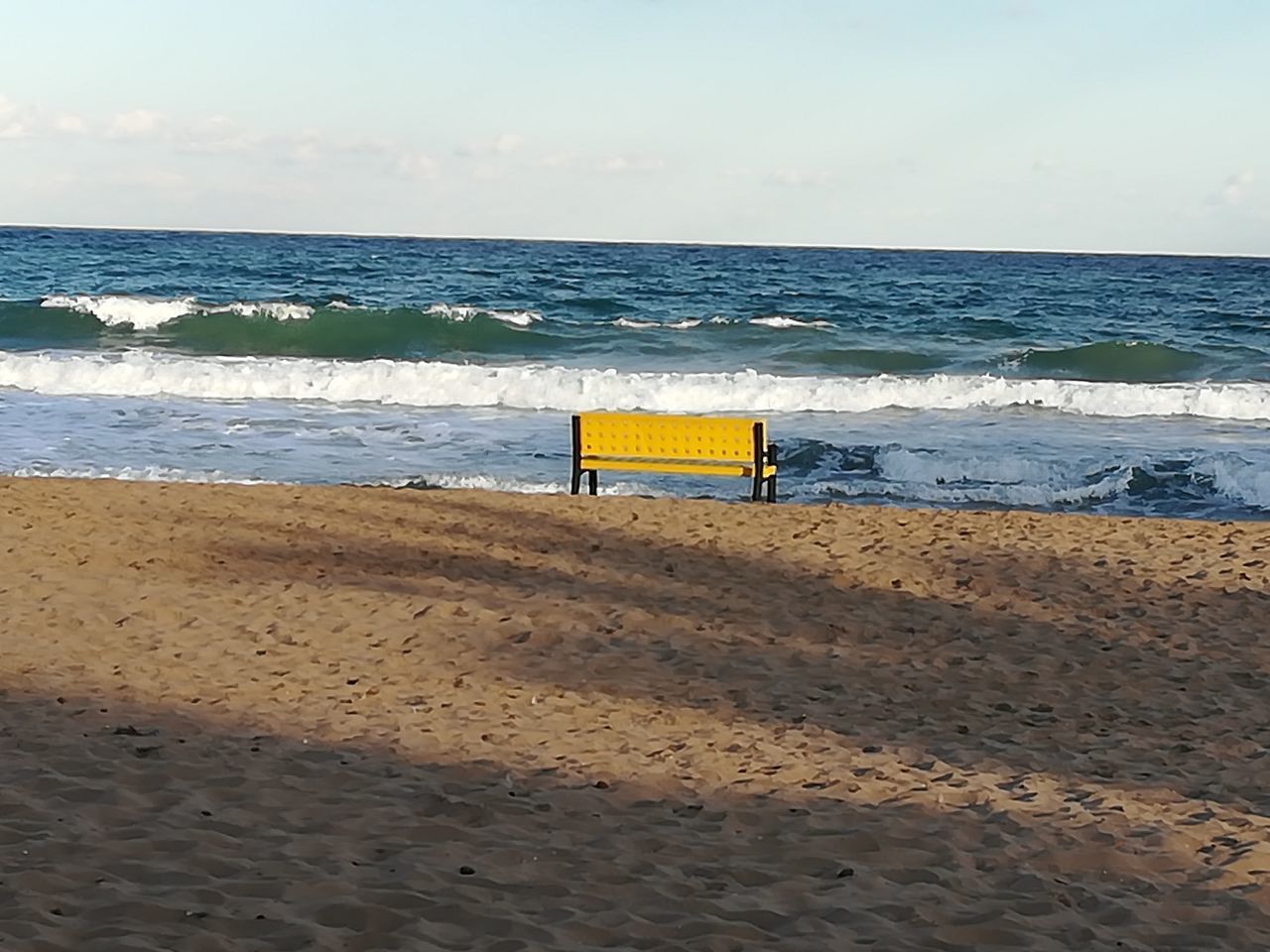 LIFEGUARD HUT ON BEACH AGAINST SKY