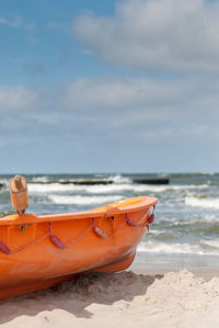 Boat on beach against sky