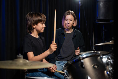 Young man playing drum