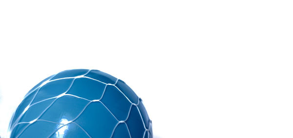 Close-up of soccer ball against white background
