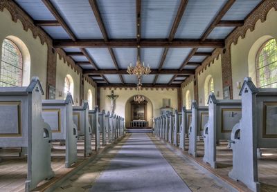 Aisle amidst pews in church