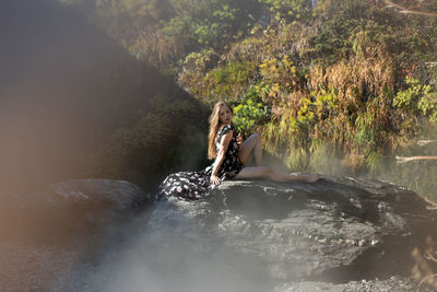 Scenic view of river flowing through rocks