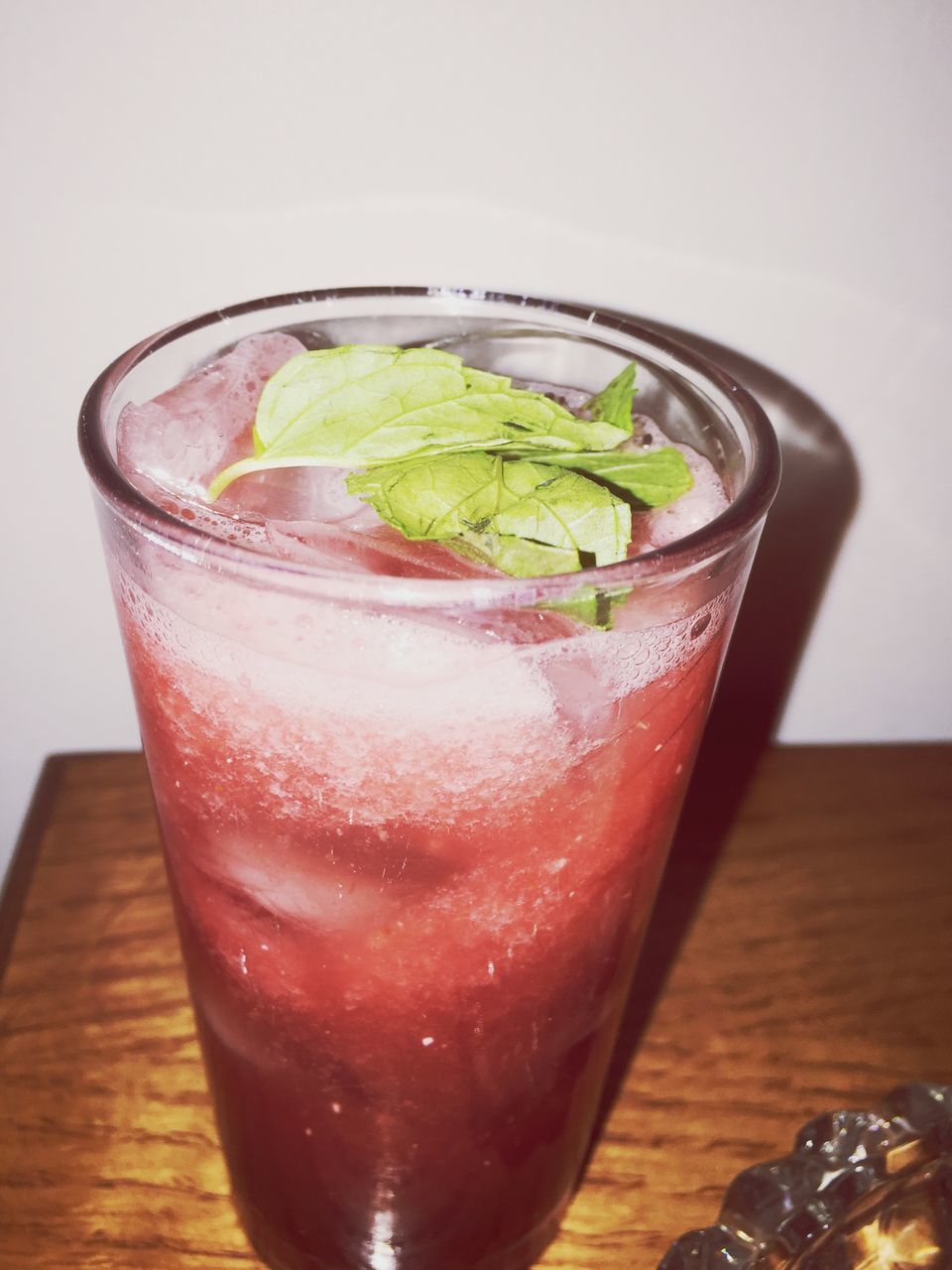 food and drink, freshness, table, indoors, still life, drinking glass, drink, refreshment, close-up, healthy eating, glass - material, food, drinking straw, glass, slice, wood - material, transparent, no people, juice, mint leaf - culinary