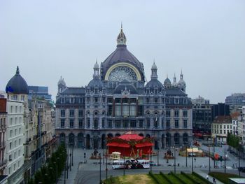 View of buildings in city against clear sky