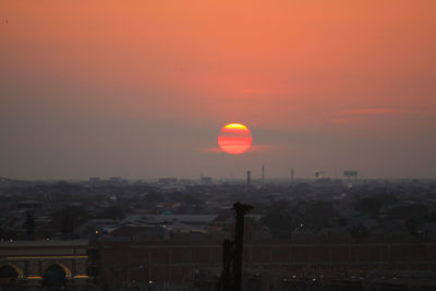 View of cityscape against sky during sunset