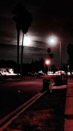 Illuminated city street at night