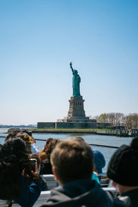 Boat going towards the statue of liberty, new york.