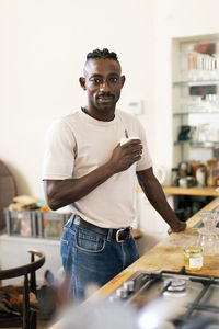 Portrait of young man working in workshop