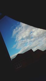 Low angle view of built structure against blue sky