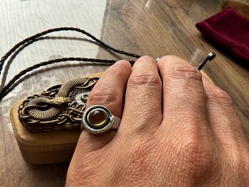 Cropped hand of person holding key ring