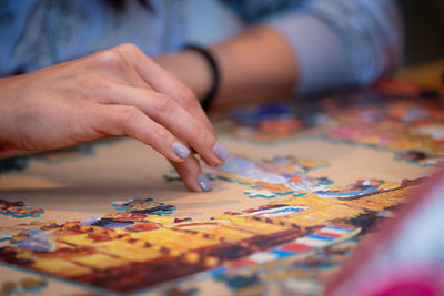 Close-up of hand holding painting