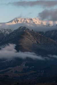 Aerial view of snowcapped mountains against sky