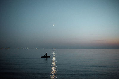 Scenic view of sea against sky at night