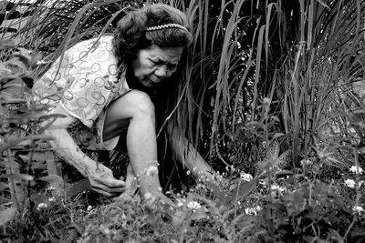 Woman sitting on field