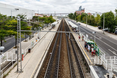 High angle view of railroad tracks amidst plants